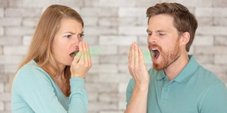 Tonsil Stones: What They Are and Who Can Remove Them 1 Two people checking their breath
