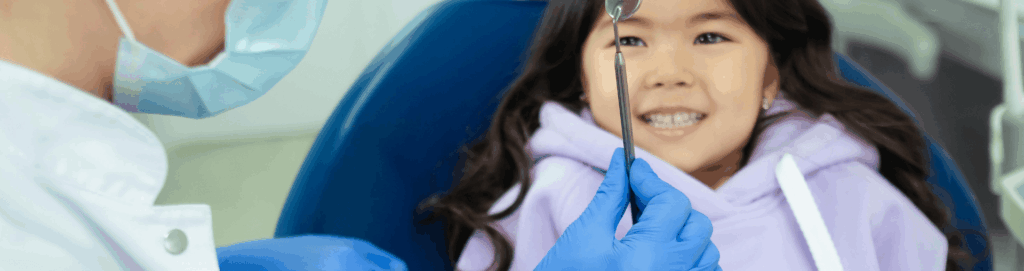 Lip Tie and Tongue Tie in Babies and Children: Signs and Treatment 1 Child at the dentist having their lip tie and frenulum checked